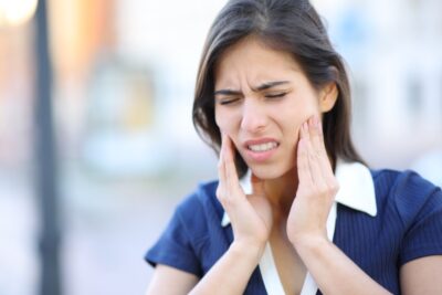 Woman with jaw pain