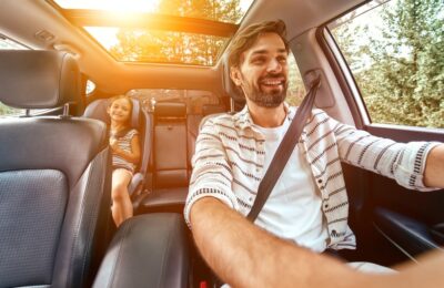 Man driving with seat belt across his chest