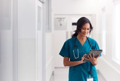 Nurse at work checking her clipboard