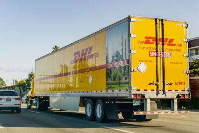 large DHL truck in traffic