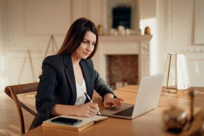 lawyer working on a client’s case on her computer