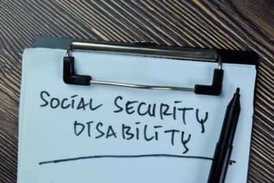 A notepad reads ‘Social Security Disability’. How much can I earn a month while on SSDI?