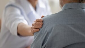 A lawyer visits an injured victim in the hospital to offer his legal services. In Georgia, it is illegal for lawyers to solicit clients before 30 days have passed since the accident.