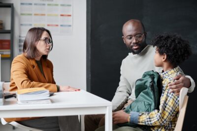 A parent speaks with his son’s teacher after he suspects a child is being sexually abused at school. 