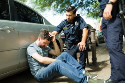 A police officer speaks with a personal injury victim and tells him how to get a police report for a car accident in Georgia.