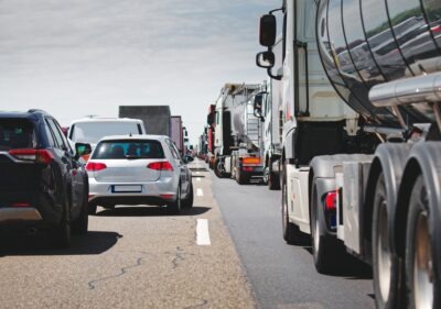 A traffic jam with commercial trucks on the road. If there was a crash, any truck accident settlement may see part of its proceeds taxed.