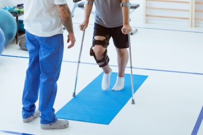 Man learning to walk on crutches. Can I file a personal injury lawsuit without a lawyer?