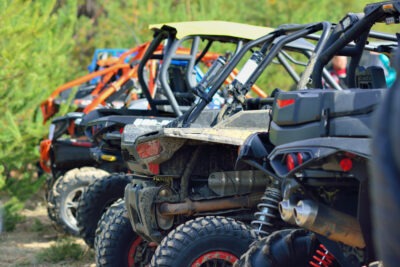 A group of side by side on the track. How is liability determined in a side-by-side (SXS) accident?