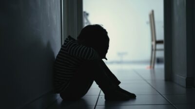 A sad child. Learn what to do if you suspect your child was sexually abused at school.